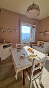 a living room with a table and a couch at Agriturismo La Corte in Pistoia