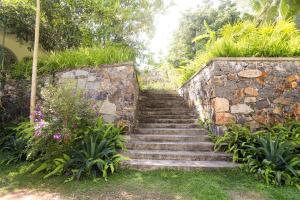 a set of stone stairs in a garden at Halcyon Galle in Galle