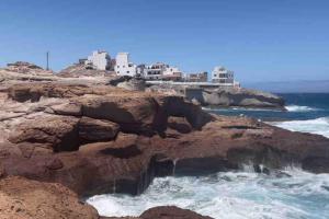 a view of the ocean from a rocky cliff at CASA NENO in La Mareta