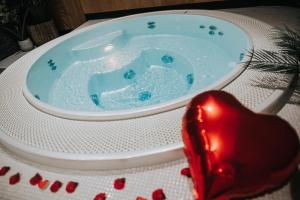 a jacuzzi tub sitting on a table with a christmas ornament at Mercure Namur Hotel in Namur