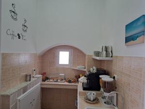 Kuchyň nebo kuchyňský kout v ubytování B&B Casa Denittis