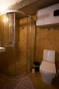 a bathroom with a shower and a toilet at House of Character in Valletta in Valletta