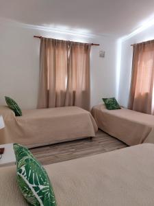 Una cama o camas en una habitación de Complejo Amarelo