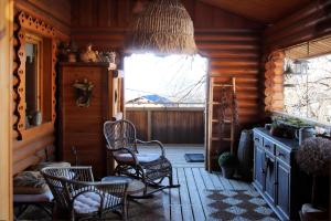 a room with chairs and a window in a cabin at Chalet Shaimoa in Font-Romeu-Odeillo-Via