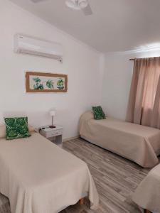 Una cama o camas en una habitación de Complejo Amarelo