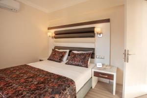 Postel nebo postele na pokoji v ubytování Arbatt Marmaris Hotel