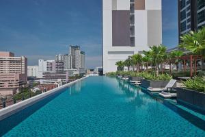 a large swimming pool on top of a building at Courtyard by Marriott Melaka in Malacca