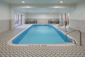 a large swimming pool in a hotel room at Fairfield by Marriott Niagara Falls, Canada in Niagara Falls