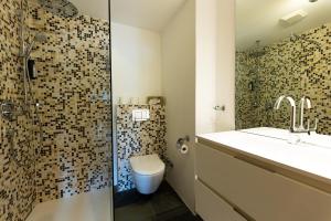 Kúpeľňa v ubytovaní Wellness Aparthotel "Lechlife" incl Pool - 400m zum LIFT