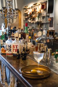 a bar with bottles of alcohol on a counter at Paragon 700 Boutique Hotel & SPA in Ostuni
