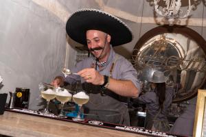 a man with a mexican hat making a drink at Paragon 700 Boutique Hotel & SPA in Ostuni