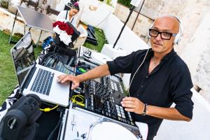 a man holding a laptop computer in a cart at Paragon 700 Boutique Hotel & SPA in Ostuni