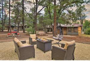 a backyard with chairs and a table and a playground at Hidden Rest Cabins and Resort in Lake of the Woods