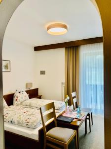 Säng eller sängar i ett rum på Tannerhof Bed & Breakfast