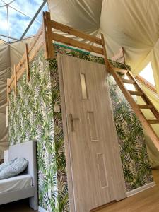 Postel nebo postele na pokoji v ubytování Tatra Glamp Mazury - sieć noclegowa Tatra Glamp