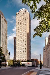 a large white building with a sign on top of it at Montreal Marriott Chateau Champlain in Montreal