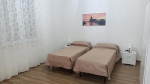 Postel nebo postele na pokoji v ubytování Scirocco e Maestrale