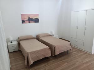 Postel nebo postele na pokoji v ubytování Scirocco e Maestrale