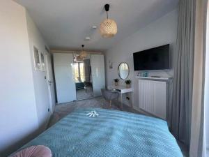 En eller flere senge i et værelse på Apartamenty Pobierowo Pinea MAX