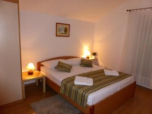 Postel nebo postele na pokoji v ubytování Apartments Toni, Borik