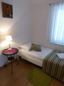 Postel nebo postele na pokoji v ubytování Apartments Toni, Borik