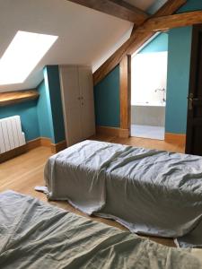 a bedroom with a bed and a large window at Le Lodge Saissac in Saissac