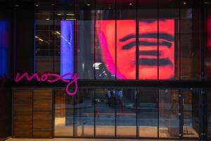 a window of a store with a sign in it at Moxy NYC Downtown in New York