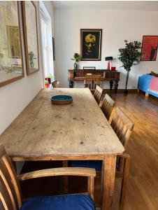 a dining room with a wooden table and chairs at Charming central 3 Bed in Dublin