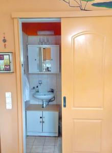 a bathroom with a sink and a white sink at Lil' fam farm home - Beach 10min in Agios Ioannis