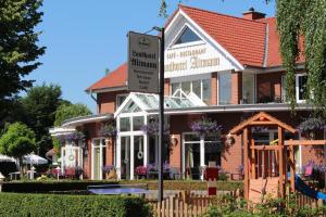 a building with a sign in front of it at Landhotel Altmann in Hörstel