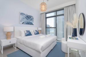 Postel nebo postele na pokoji v ubytování Vogue Beachfront - Palm Views & Private Beach