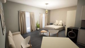 1 dormitorio con 1 cama, mesa y sillas en Gest, en Mellieħa