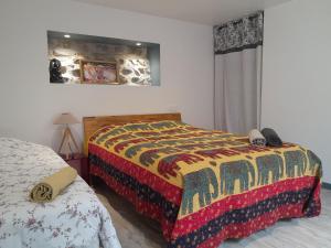 Postel nebo postele na pokoji v ubytování Loft vue montagne