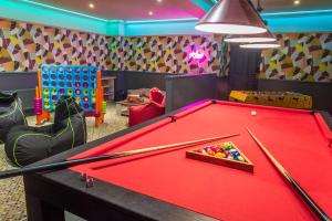 a room with a pool table with cue balls on it at Lakeside Hotel and Spa in Newby Bridge