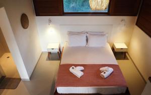 Postel nebo postele na pokoji v ubytování Manawa Bangalôs
