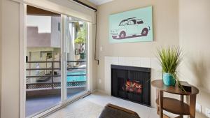 a living room with a fireplace and a window at Luxury, Hollywood Walk of Fame in Los Angeles