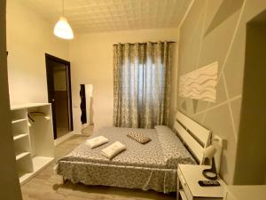 A bed or beds in a room at Guest House Minas