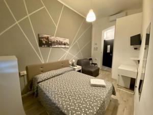 A bed or beds in a room at Guest House Minas