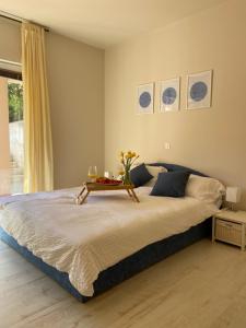 a bedroom with a large bed with a table on it at Apartments Eva in Savar +44 photos