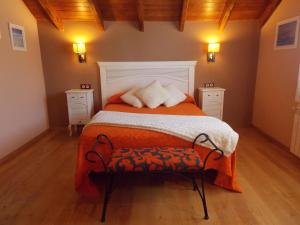 Postel nebo postele na pokoji v ubytování Hostal El Recanto