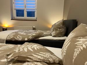 Säng eller sängar i ett rum på Pyhra - Urlaub im Elsbeerland