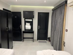 Voodi või voodid majutusasutuse Helio Cairo Hotel toas