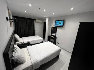 Voodi või voodid majutusasutuse Helio Cairo Hotel toas