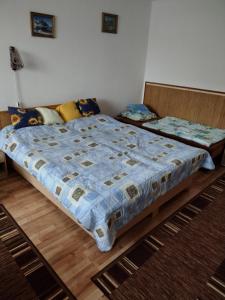 Posteľ alebo postele v izbe v ubytovaní Dom pod Tatrami.