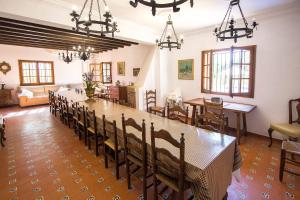 a large dining room with a long table and chairs at Catalunya Casas: Spacious Villa Vera up to 24 guests, a short drive to Blanes! in Girona