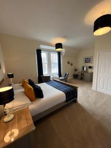 a bedroom with a large bed and a window at Glentower Lower Observatory in Fort William