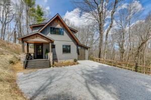 a house on a hill with a driveway at Cottage with Screened Porch and Trails Near Cashiers! in Glenville