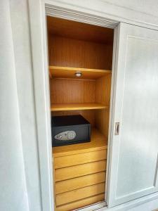a room with a closet with a radio in it at Villa Katerina in Caleta De Fuste