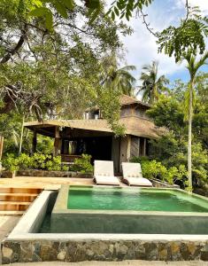 Bazén v ubytování Cabaña junto al mar nebo v jeho okolí