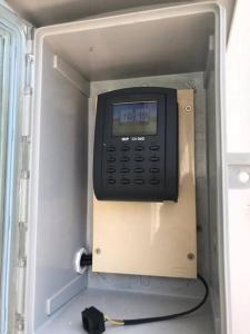 un telefono dell'ufficio con un orologio sul lato di Sclass HOME Private, Central old city (Wholehouse) a Chiang Mai